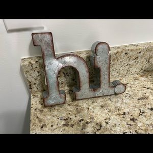 Galvanized metal “hi” greeting.